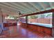 Picturesque view of the wood porch with outdoor lighting overlooking the backyard pool at 1220 E Avenida Ellena St, Casa Grande, AZ 85122