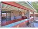 Cozy back porch area with ceiling fan, lights, sliding glass doors and a view of the yard at 1220 E Avenida Ellena St, Casa Grande, AZ 85122