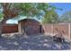 Backyard with a storage shed, firepit and gravel landscaping for minimal maintenance at 1220 E Avenida Ellena St, Casa Grande, AZ 85122