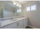 Well-lit bathroom showcasing a large mirror, vanity with storage, and a shower-tub combination at 1220 E Avenida Ellena St, Casa Grande, AZ 85122