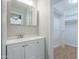 Bathroom vanity with walk-in closet with wood floor at 1220 E Avenida Ellena St, Casa Grande, AZ 85122