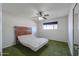 Bedroom with ceiling fan, window, and adjustable bed frame at 1220 E Avenida Ellena St, Casa Grande, AZ 85122
