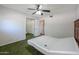 Bedroom with ceiling fan, window, and adjustable bed frame at 1220 E Avenida Ellena St, Casa Grande, AZ 85122