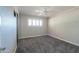 Bedroom with ceiling fan, window, and carpet at 1220 E Avenida Ellena St, Casa Grande, AZ 85122