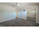 Bedroom with ceiling fan, carpet and closet with mirrored doors at 1220 E Avenida Ellena St, Casa Grande, AZ 85122