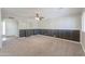 Expansive bonus room featuring neutral tones, carpet flooring, and wainscotting at 1220 E Avenida Ellena St, Casa Grande, AZ 85122