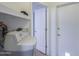 Functional laundry area with storage and access to the backyard at 1220 E Avenida Ellena St, Casa Grande, AZ 85122