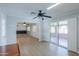 Living room features a ceiling fan and slider to the covered patio at 1220 E Avenida Ellena St, Casa Grande, AZ 85122