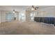 Spacious living room with ceiling fans and updated flooring throughout at 1220 E Avenida Ellena St, Casa Grande, AZ 85122