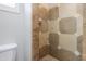 Walk-in shower with neutral color ceramic tile and chrome shower head at 1220 E Avenida Ellena St, Casa Grande, AZ 85122
