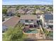 An aerial view shows a backyard pool, balcony, and privacy fence for this home in a neighborhood with mountain views at 12209 W Washington St, Avondale, AZ 85323