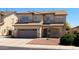 Charming two-story home with a tile roof, a two-car garage, and desert landscaping at 12209 W Washington St, Avondale, AZ 85323