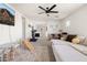 Cozy living room with play area, plush seating, ceiling fan, and bright decor, perfect for relaxation and play at 12209 W Washington St, Avondale, AZ 85323