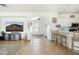 Bright, open living area with tile flooring, modern decor, and seamless flow to kitchen at 12209 W Washington St, Avondale, AZ 85323