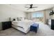 Spacious main bedroom with serene views, a ceiling fan, sliding glass doors to balcony, and plush carpeting at 12209 W Washington St, Avondale, AZ 85323