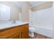 This bathroom has a single sink vanity and shower over tub at 12450 W Hearn Rd, El Mirage, AZ 85335