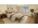 Inviting bedroom featuring neutral colors, a large window, and comfortable furnishings at 12450 W Hearn Rd, El Mirage, AZ 85335