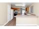 The kitchen features wood cabinets, white appliances, a breakfast bar, and plenty of counter space at 12450 W Hearn Rd, El Mirage, AZ 85335