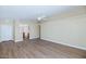 Spacious living room featuring wood floors, high ceilings and a ceiling fan at 12450 W Hearn Rd, El Mirage, AZ 85335