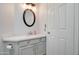 Bathroom featuring sink, toilet, tile floors, granite countertops, and updated light fixture at 1331 W Baseline Rd # 120, Mesa, AZ 85202