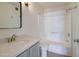 Bathroom showcasing a vanity with granite countertops, toilet, and a shower-tub combo at 1331 W Baseline Rd # 120, Mesa, AZ 85202