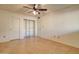 Bright bedroom features a closet, ceiling fan, and tile floors for easy maintenance at 1331 W Baseline Rd # 120, Mesa, AZ 85202