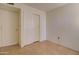 Bedroom features tile floors, closet with sliding doors, and a secondary door at 1331 W Baseline Rd # 120, Mesa, AZ 85202