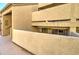 Building exterior showcasing modern architecture, private balconies, and access to upper-level units, set in a well-kept community at 1331 W Baseline Rd # 120, Mesa, AZ 85202