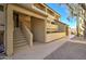 Exterior view of a modern apartment building featuring multiple floors, private balconies, and well-maintained landscaping at 1331 W Baseline Rd # 120, Mesa, AZ 85202