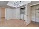 Functional laundry area features a washer, dryer, and shelving at 1331 W Baseline Rd # 120, Mesa, AZ 85202