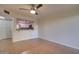 Bright living room with tile flooring, open to the kitchen, and a ceiling fan at 1331 W Baseline Rd # 120, Mesa, AZ 85202