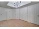 Versatile room features neutral walls, tile flooring, and multiple closet spaces for storage at 1331 W Baseline Rd # 120, Mesa, AZ 85202