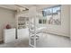 bedroom with lofted bed, built-in desk, shelving, and bright natural light at 15037 N 114Th Way, Scottsdale, AZ 85255