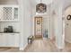 Bright foyer featuring a decorative door, tile floors, and stylish light fixture at 15037 N 114Th Way, Scottsdale, AZ 85255