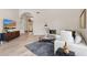 Spacious living room featuring stylish furnishings, a plush rug, and neutral decor at 15037 N 114Th Way, Scottsdale, AZ 85255