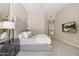 Cozy primary bedroom with carpet floors, a bed, a nightstand, and a large TV on the wall at 15037 N 114Th Way, Scottsdale, AZ 85255