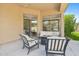 Covered patio complete with fire pit and comfortable seating for relaxation and entertaining at 15037 N 114Th Way, Scottsdale, AZ 85255