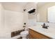 Bathroom featuring a shower/tub combo, white vanity, and neutral decor at 1617 W Pecan Rd, Phoenix, AZ 85041