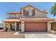 Charming two-story home features a well-maintained exterior, two-car garage, and lovely curb appeal at 1617 W Pecan Rd, Phoenix, AZ 85041