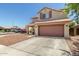 Charming two-story home features a well-maintained exterior, two-car garage, and lovely curb appeal at 1617 W Pecan Rd, Phoenix, AZ 85041