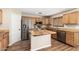 Stylish kitchen equipped with stainless steel appliances, granite countertops, and a center island at 1617 W Pecan Rd, Phoenix, AZ 85041