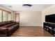Inviting living room featuring new flooring, neutral paint, and ample natural light at 1617 W Pecan Rd, Phoenix, AZ 85041