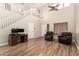 Spacious living room boasting high ceilings, wood floors, and a cozy, inviting atmosphere at 1617 W Pecan Rd, Phoenix, AZ 85041