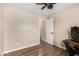 Bright office with wood floors, ceiling fan, and a view of the hallway at 1617 W Pecan Rd, Phoenix, AZ 85041