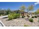 This backyard has desert landscaping and block wall, offering privacy and a unique aesthetic at 16551 W Desert Ln, Goodyear, AZ 85338
