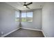 Bright bedroom featuring carpet floors, neutral walls and a modern ceiling fan at 16551 W Desert Ln, Goodyear, AZ 85338