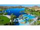 Aerial view of the community pool and lake, showcasing the resort-style amenities at 16551 W Desert Ln, Goodyear, AZ 85338