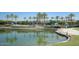 Beautiful community pool area with palm trees, lounge seating and lush landscaping at 16551 W Desert Ln, Goodyear, AZ 85338