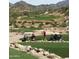 Picturesque golf course with players enjoying a round amidst the scenic desert landscape at 16551 W Desert Ln, Goodyear, AZ 85338