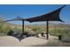 Outdoor picnic area with shaded tables, seating, and desert views, ideal for community gatherings and Gathering outings at 16551 W Desert Ln, Goodyear, AZ 85338